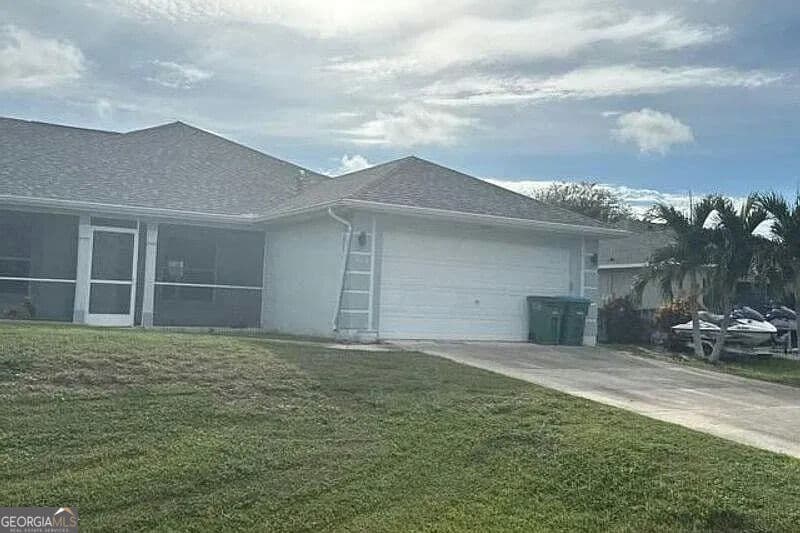 3 bedroom, 2 bathroom, 2,035 sq ft single family residence for sale at 235 NW 25th Place, Cape Coral, FL 33993 — photo 1 of 5