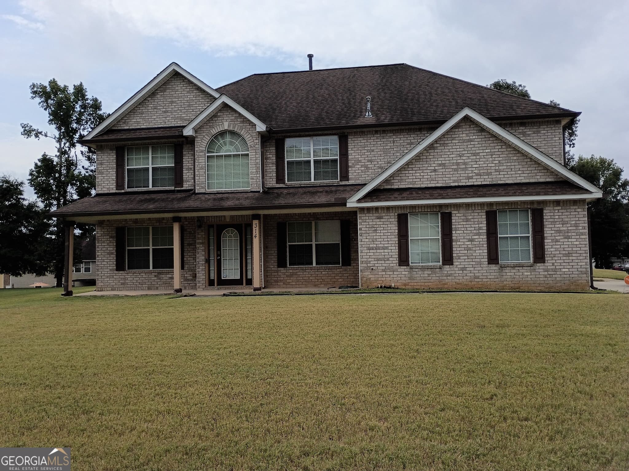 4 bedroom, 3 bathroom, 2,691 sq ft single family residence for sale at 314 Megan Drive, Hampton, GA 30228 — photo 1 of 13