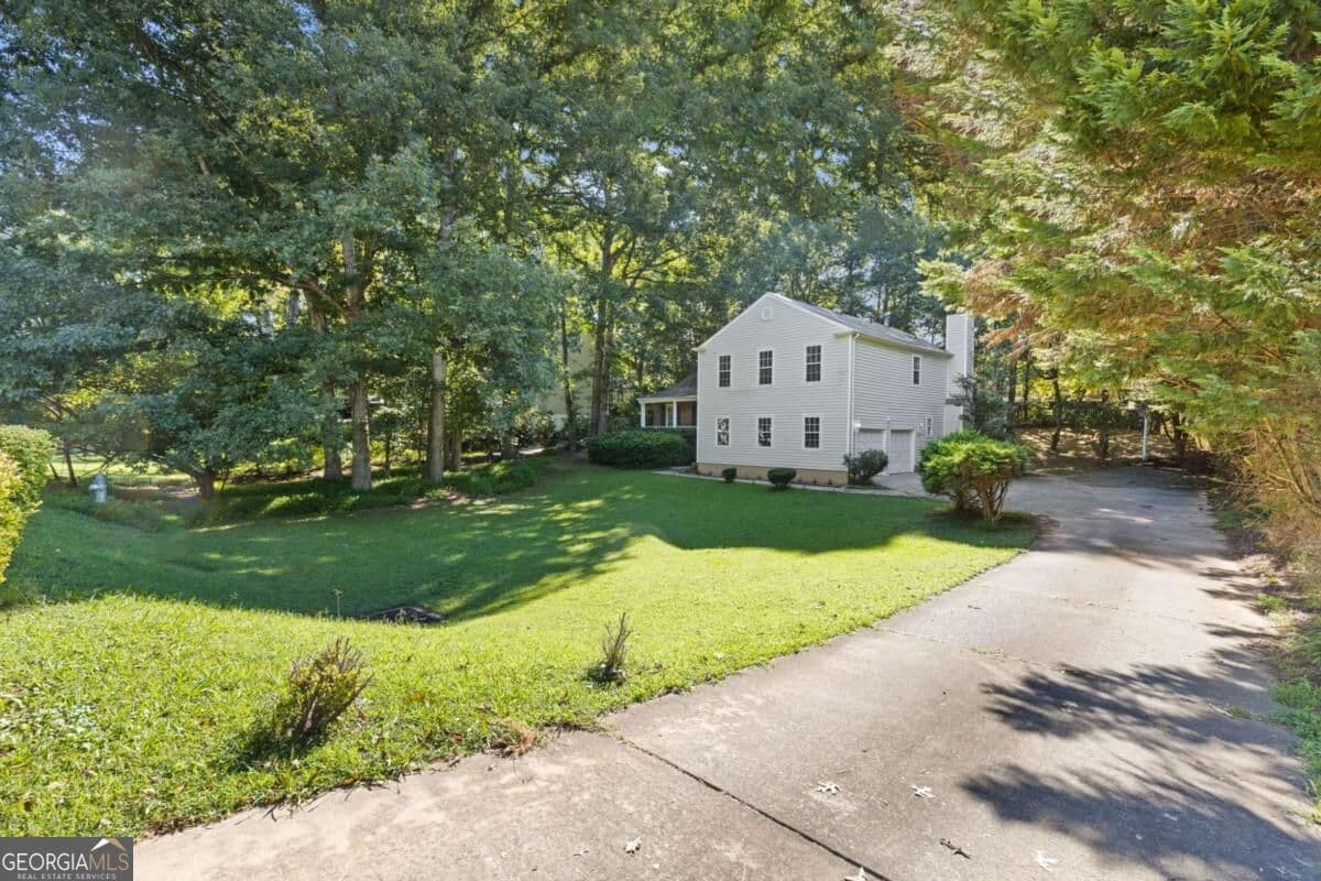 4 bedroom, 2.5 bathroom, 2,244 sq ft single family residence for sale at 3877 Peachtree Corners Circle, Peachtree Corners, GA 30092 — photo 2