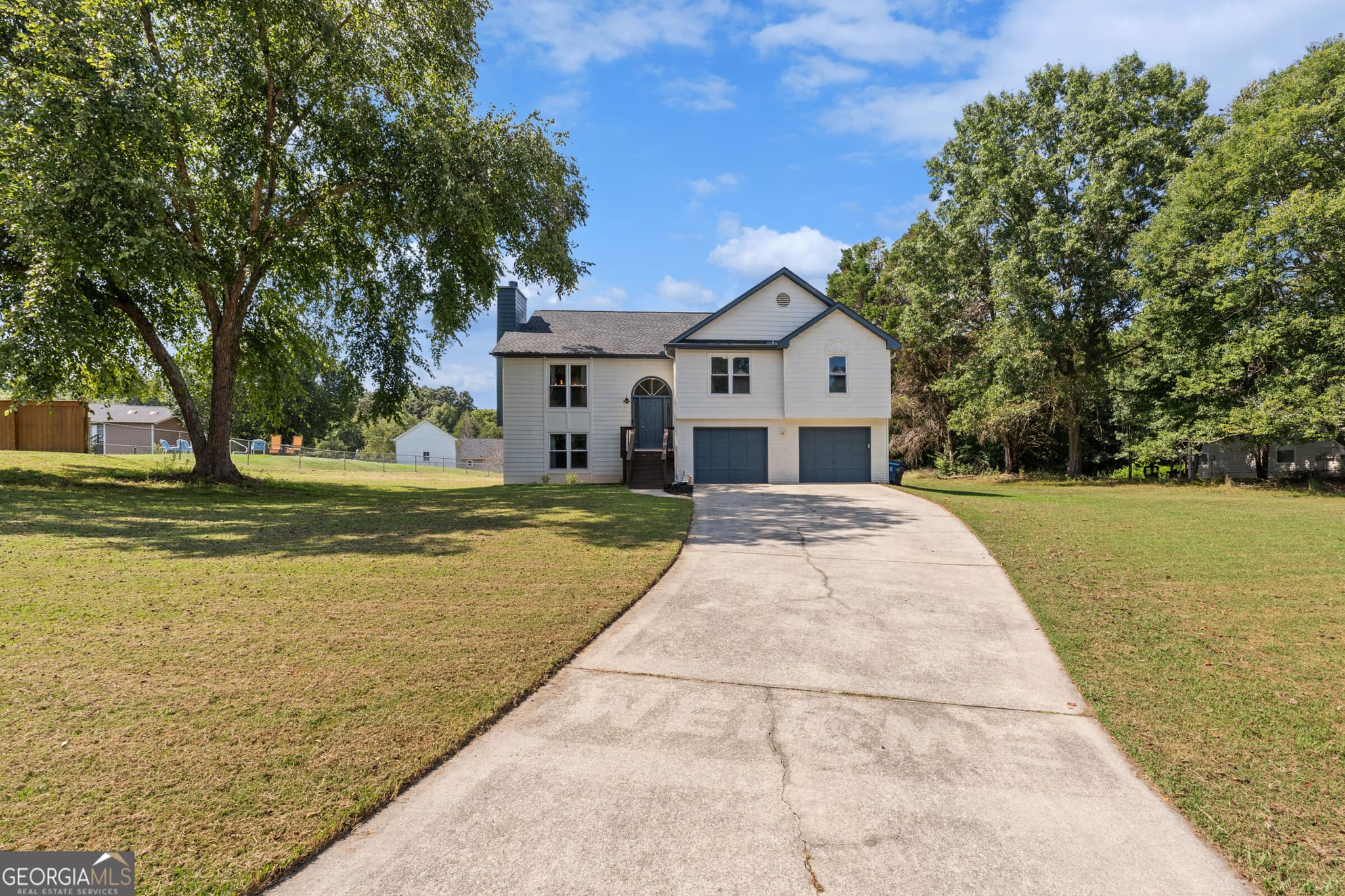 4 bedroom, 3 bathroom, 2,014 sq ft single family residence for sale at 4650 Wheeler Creek Drive, Hoschton, GA 30548 — photo 1 of 51