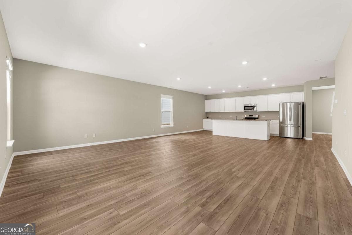4 bedroom, 2.5 bathroom, 2,435 sq ft single family residence for sale at 4335 Magpie Drive, Hoschton, GA 30548 — photo 2