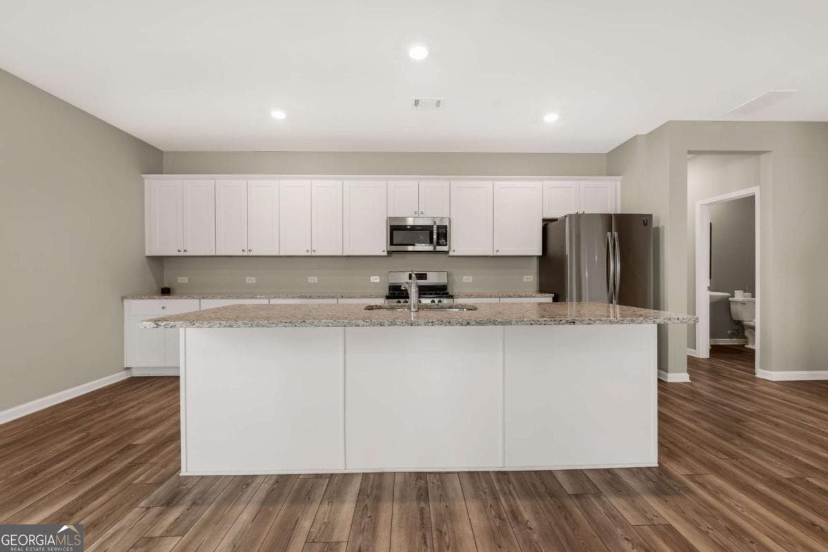 4 bedroom, 2.5 bathroom, 2,435 sq ft single family residence for sale at 4335 Magpie Drive, Hoschton, GA 30548 — photo 3