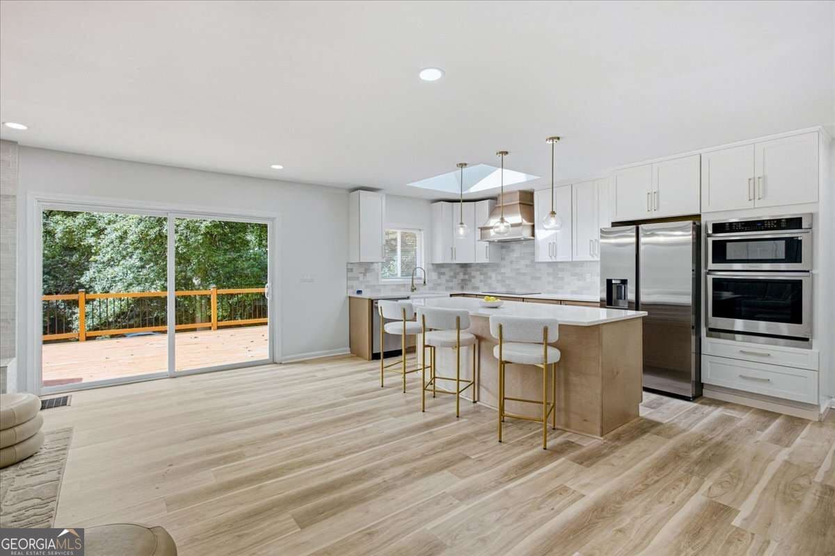 6 bedroom, 4 bathroom single family residence for sale at 3130 Henderson Mill Road, Atlanta, GA 30341 — photo 7
