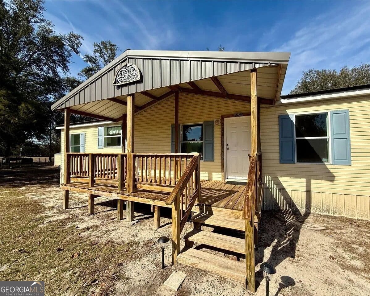 5 bedroom, 3 bathroom, 1,728 sq ft manufactured home,single family residence for sale at 27910 NW 46th Avenue, Newberry, FL 32669 — photo 2
