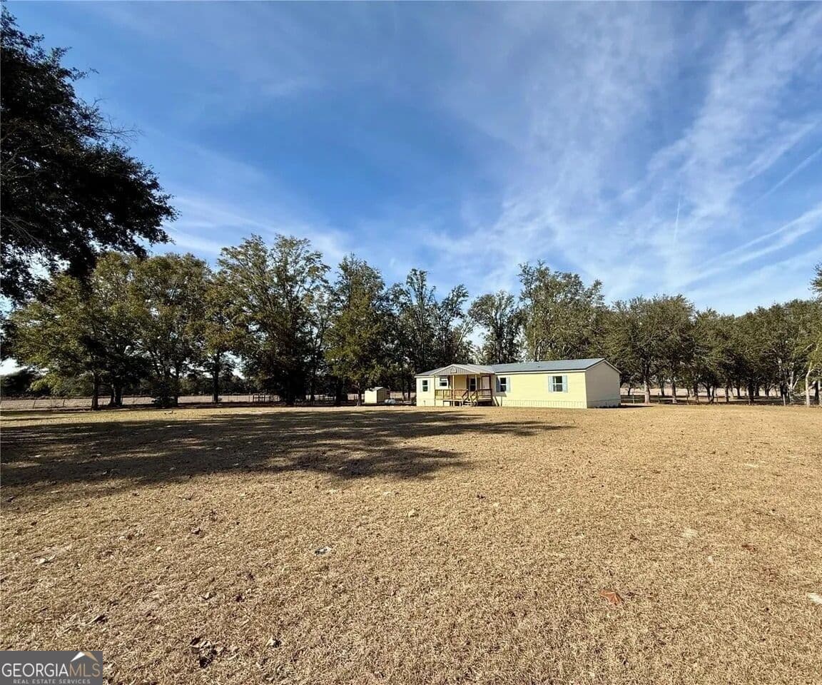5 bedroom, 3 bathroom, 1,728 sq ft manufactured home,single family residence for sale at 27910 NW 46th Avenue, Newberry, FL 32669 — photo 6