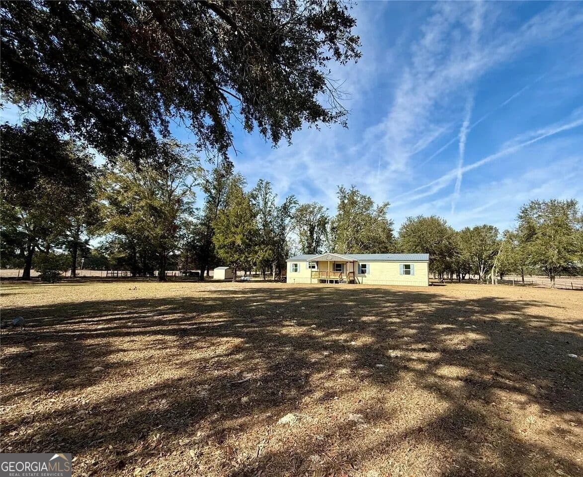 5 bedroom, 3 bathroom, 1,728 sq ft manufactured home,single family residence for sale at 27910 NW 46th Avenue, Newberry, FL 32669 — photo 4