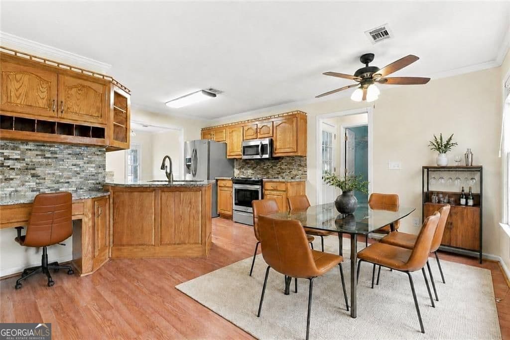 4 bedroom, 2.5 bathroom, 2,344 sq ft single family residence for sale at 2232 Woodbriar Drive, Buford, GA 30518 — photo 2