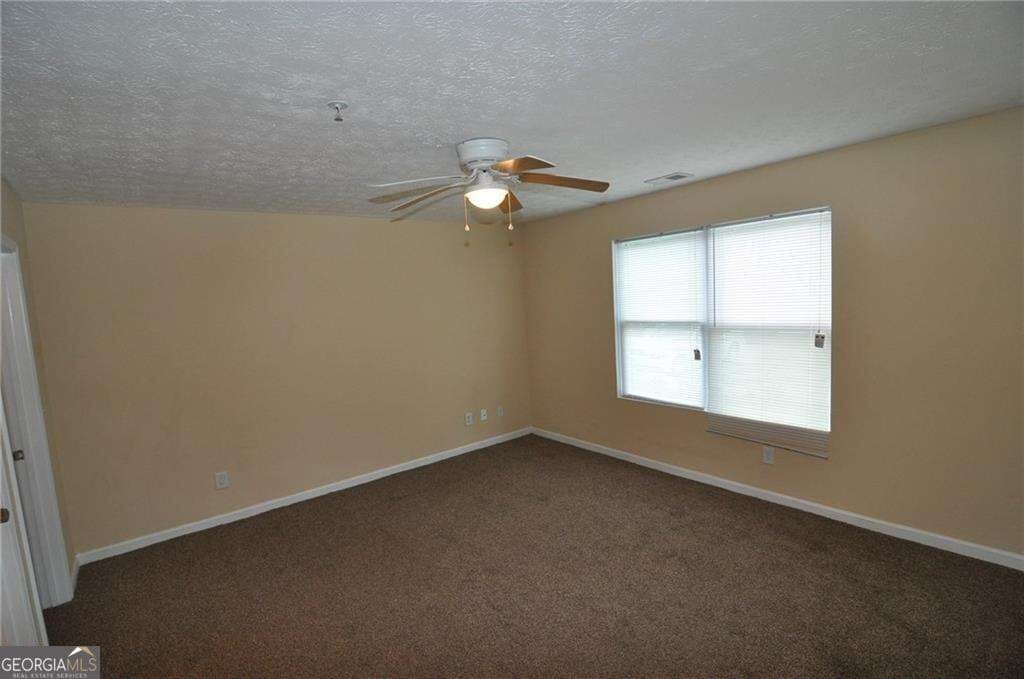 3 bedroom, 2 bathroom, 1,202 sq ft condominium for sale at 8304 Par Four Way, Lithonia, GA 30038 — photo 4