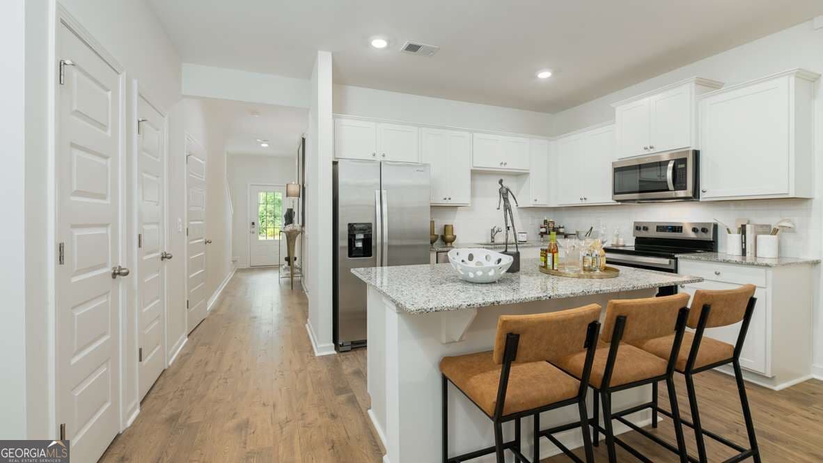 3 bedroom, 2.5 bathroom townhouse for sale at 2807 Goergia Aster Way 52, Atlanta, GA 30349 — photo 3