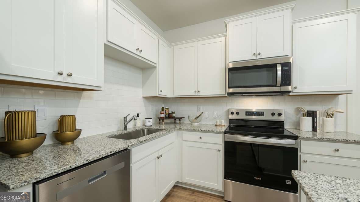3 bedroom, 2.5 bathroom townhouse for sale at 2807 Goergia Aster Way 52, Atlanta, GA 30349 — photo 5