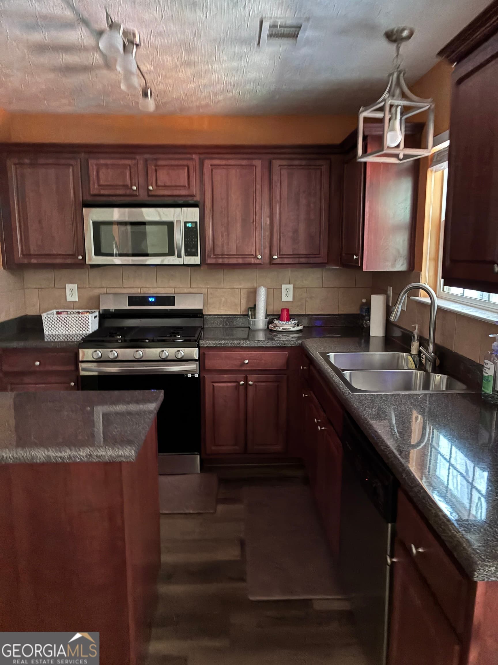 6 bedroom, 4 bathroom, 3,910 sq ft single family residence for sale at 4323 Grove Lake Street, Loganville, GA 30052 — photo 6
