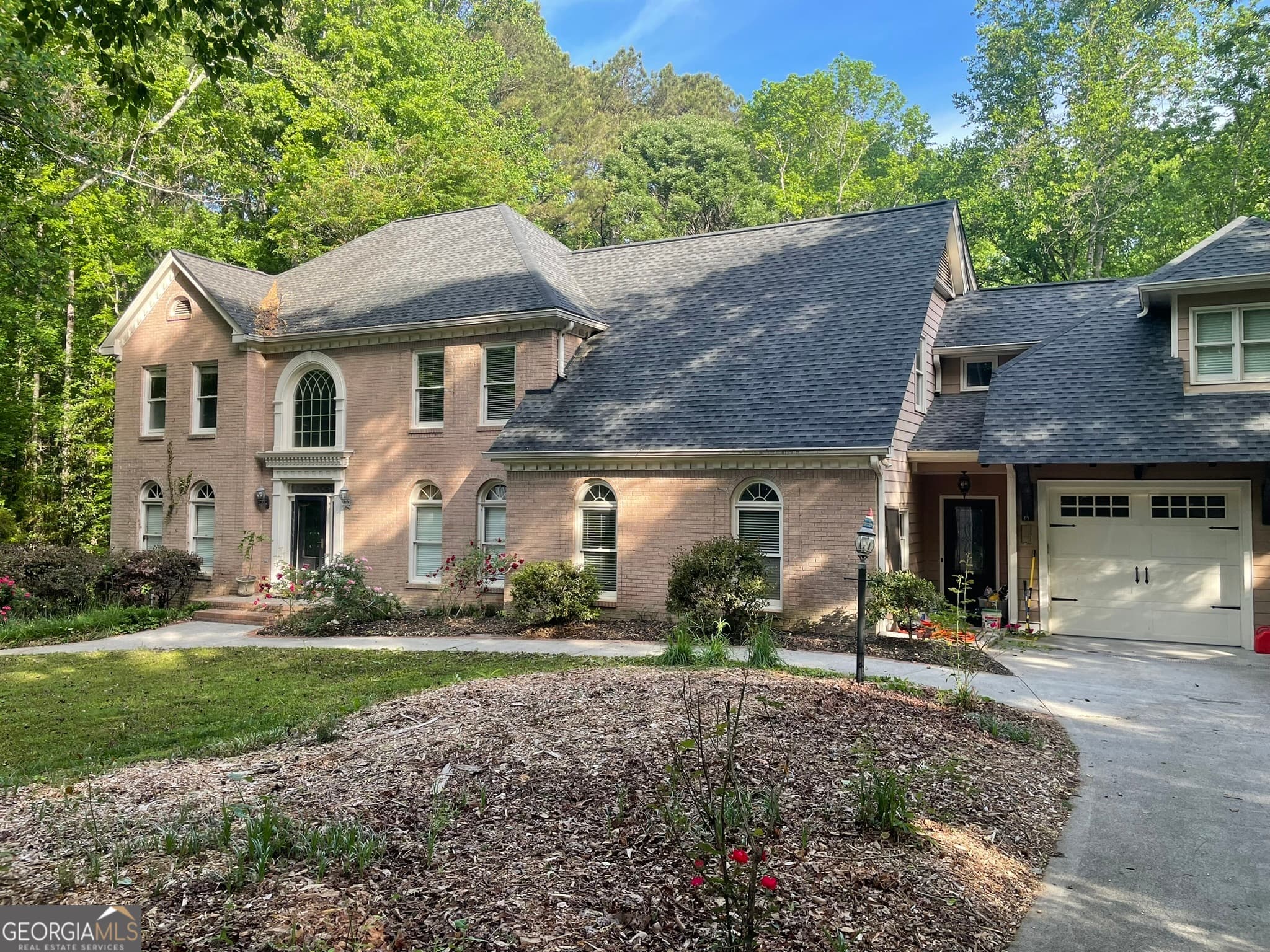 6 bedroom, 5 bathroom, 6,938 sq ft single family residence for sale at 5279 Rocky Hill Drive, Lilburn, GA 30047 — photo 1 of 93