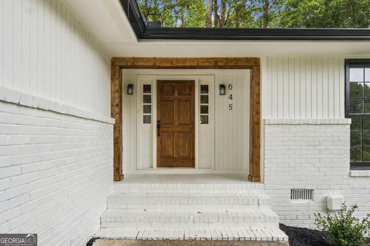 4 bedroom, 3 bathroom, 1,716 sq ft single family residence for sale at 645 Noell Way, Lilburn, GA 30047 — photo 2