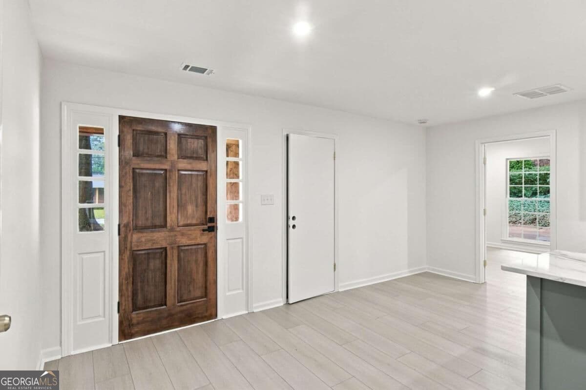 4 bedroom, 3 bathroom, 1,716 sq ft single family residence for sale at 645 Noell Way, Lilburn, GA 30047 — photo 3