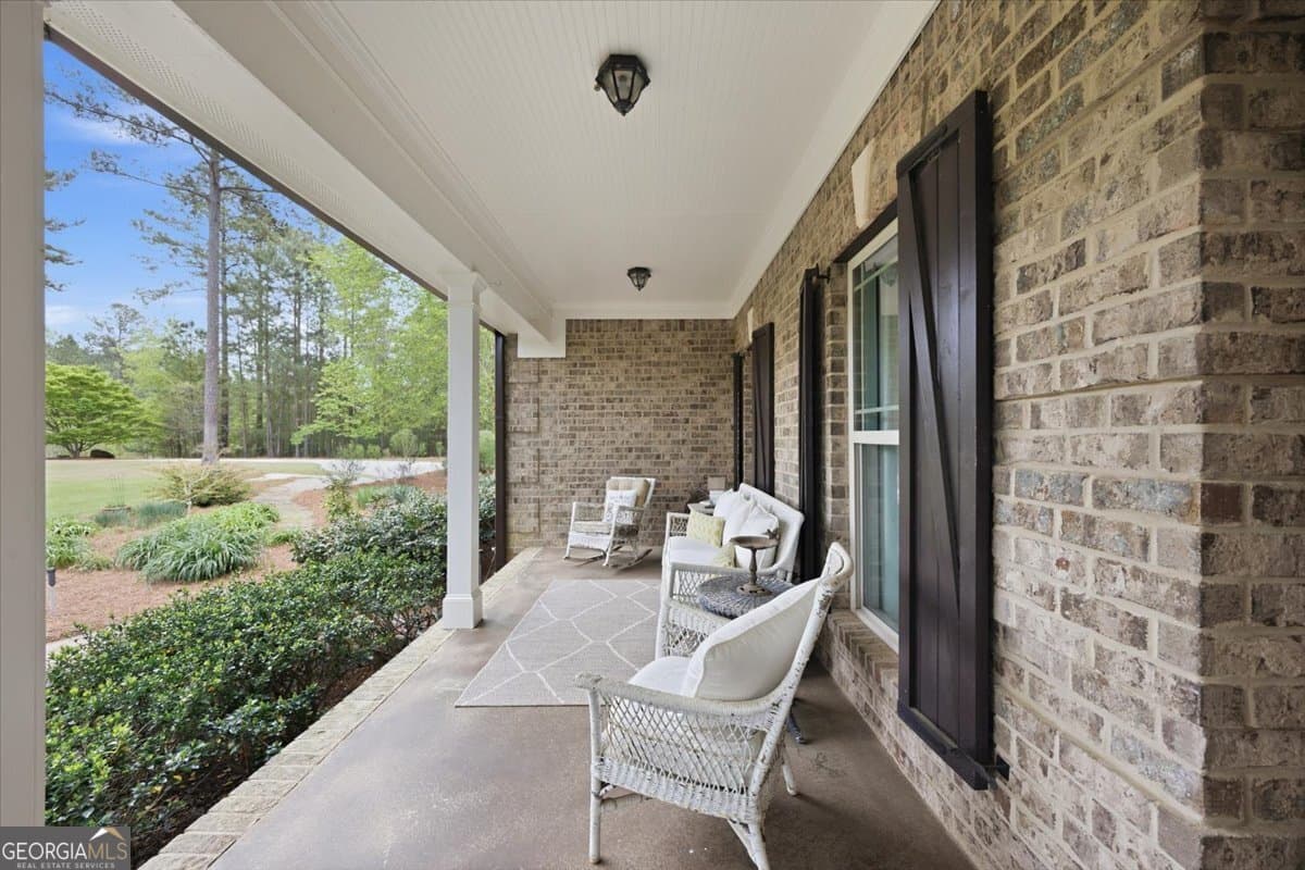 5 bedroom, 5.5 bathroom, 6,027 sq ft single family residence for sale at 111 Piedmont Circle, Forsyth, GA 31029 — photo 2