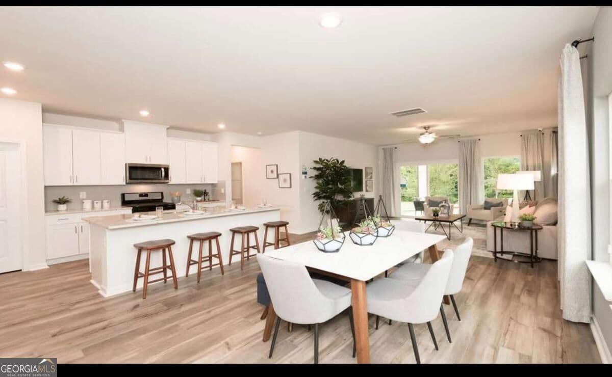 5 bedroom, 3 bathroom, 2,420 sq ft single family residence for sale at 104 NESBIT Drive, Holly Springs, GA 30114 — photo 5