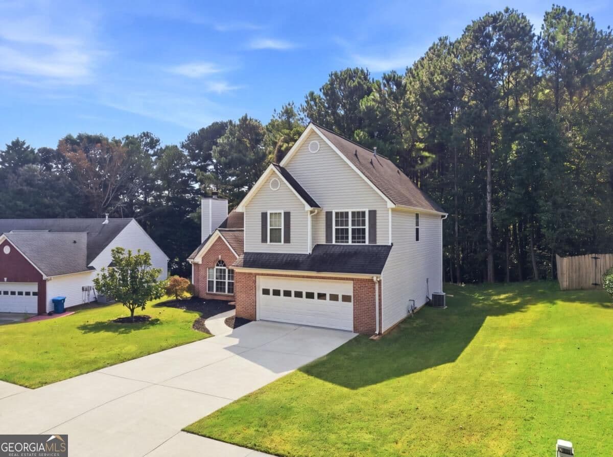 4 bedroom, 3 bathroom, 1,949 sq ft single family residence for sale at 1865 Heatherton Road, Dacula, GA 30019 — photo 2