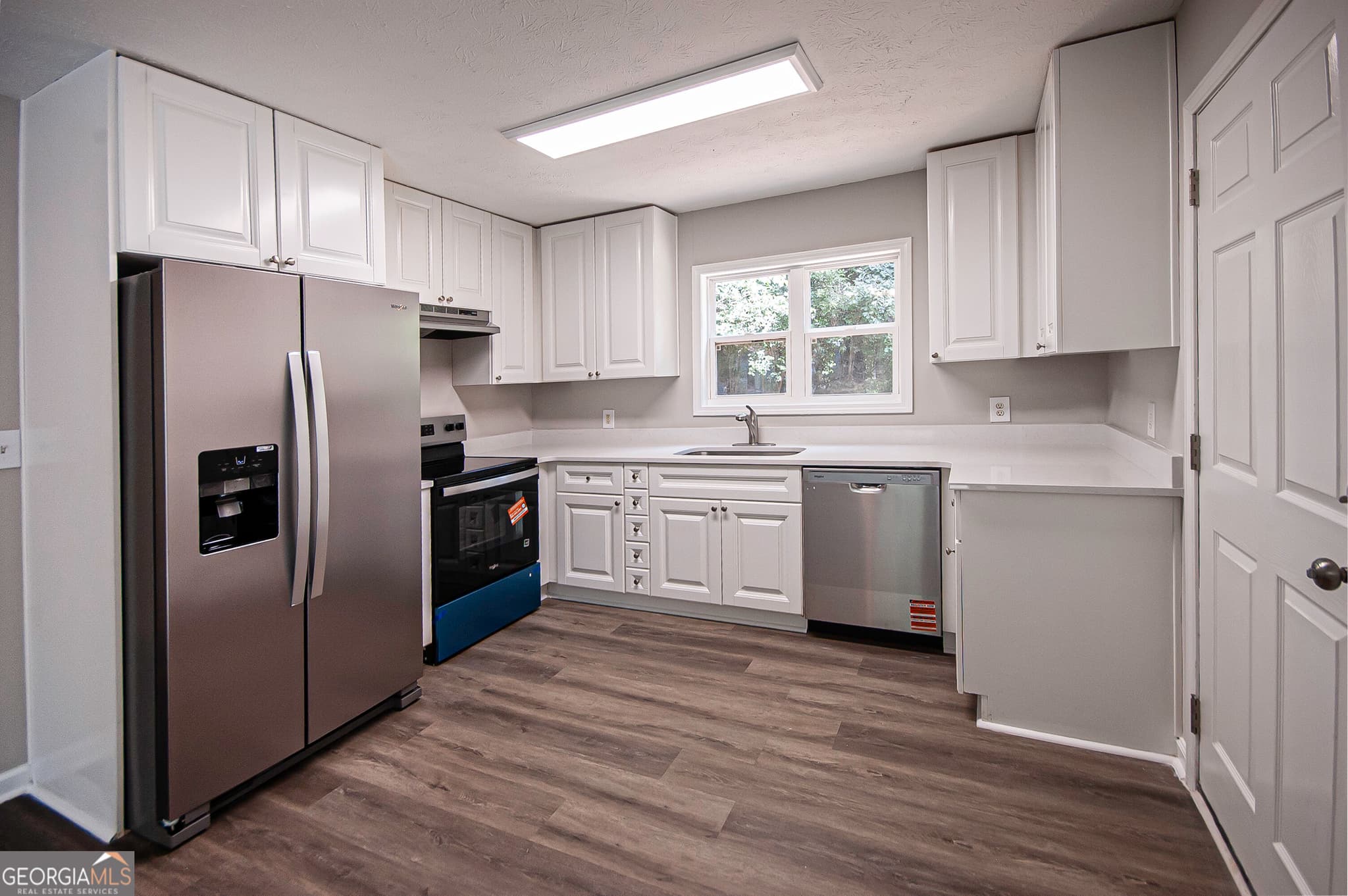 3 bedroom, 2 bathroom, 1,287 sq ft single family residence for sale at 8454 Hightower Trail, Snellville, GA 30039 — photo 7