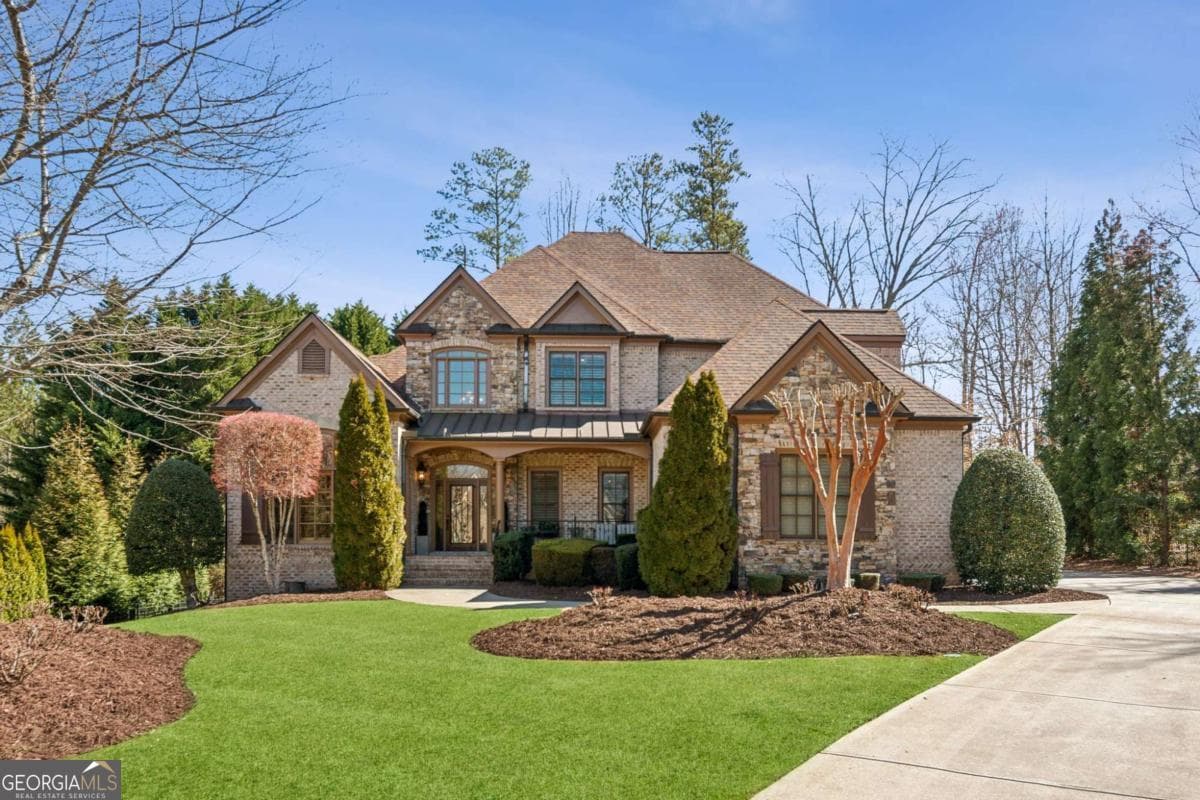 4 bedroom, 4.5 bathroom, 3,958 sq ft single family residence for sale at 5640 Copper Creek Pass, Cumming, GA 30040 — photo 2
