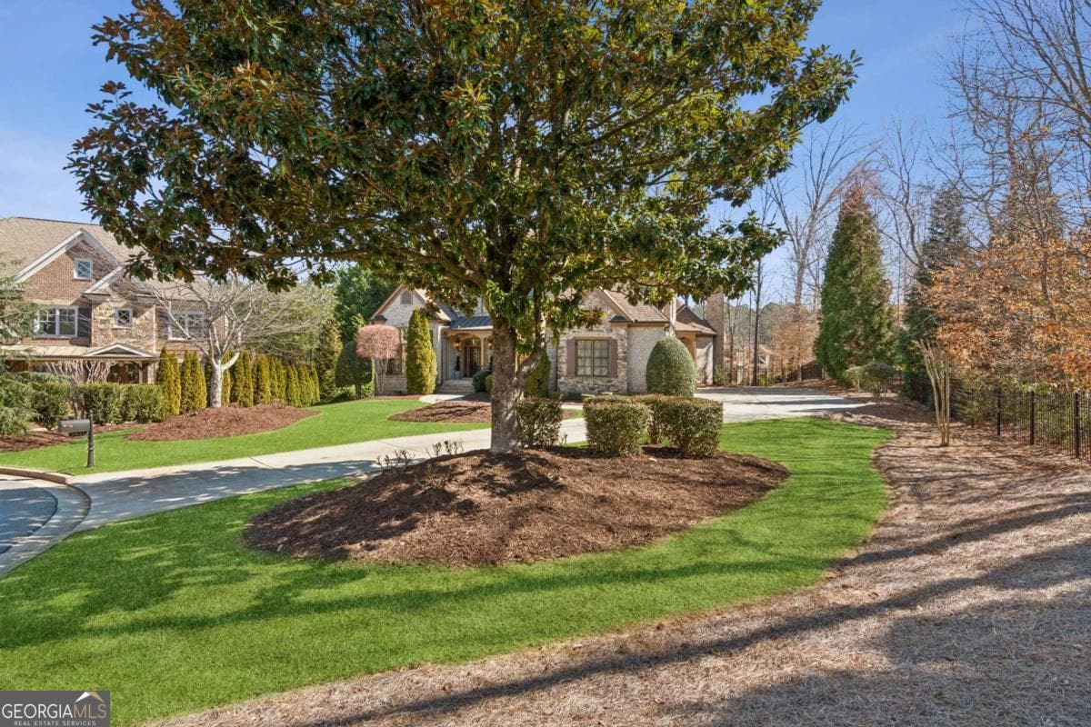 4 bedroom, 4.5 bathroom, 3,958 sq ft single family residence for sale at 5640 Copper Creek Pass, Cumming, GA 30040 — photo 3