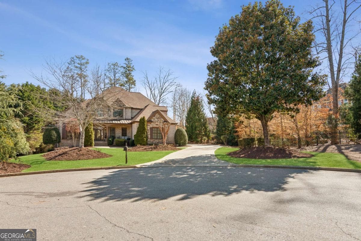 4 bedroom, 4.5 bathroom, 3,958 sq ft single family residence for sale at 5640 Copper Creek Pass, Cumming, GA 30040 — photo 1 of 48