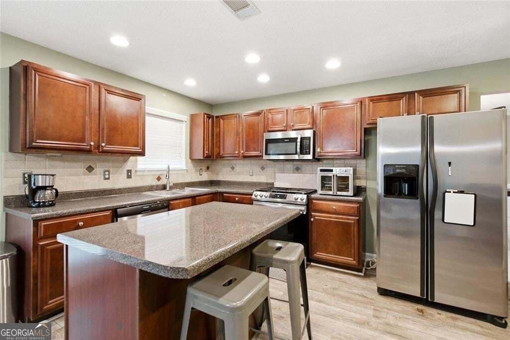 5 bedroom, 3 bathroom, 3,490 sq ft single family residence for sale at 5503 Mudlark Circle, Powder Springs, GA 30127 — photo 4