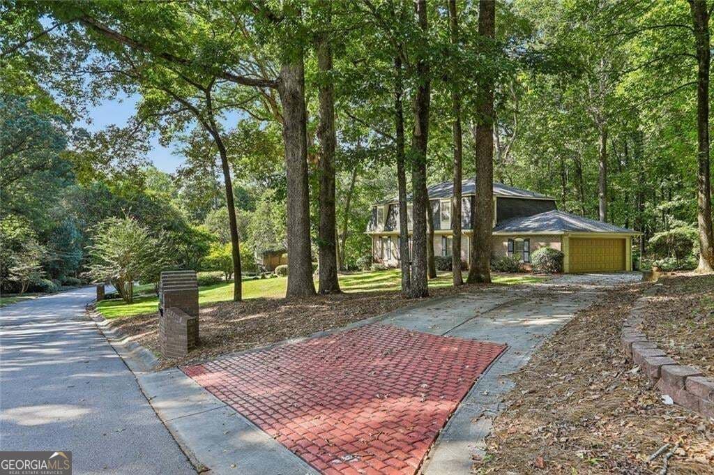 4 bedroom, 2.5 bathroom, 3,915 sq ft single family residence for sale at 4988 Mountclaire Road, Stone Mountain, GA 30087 — photo 1 of 52