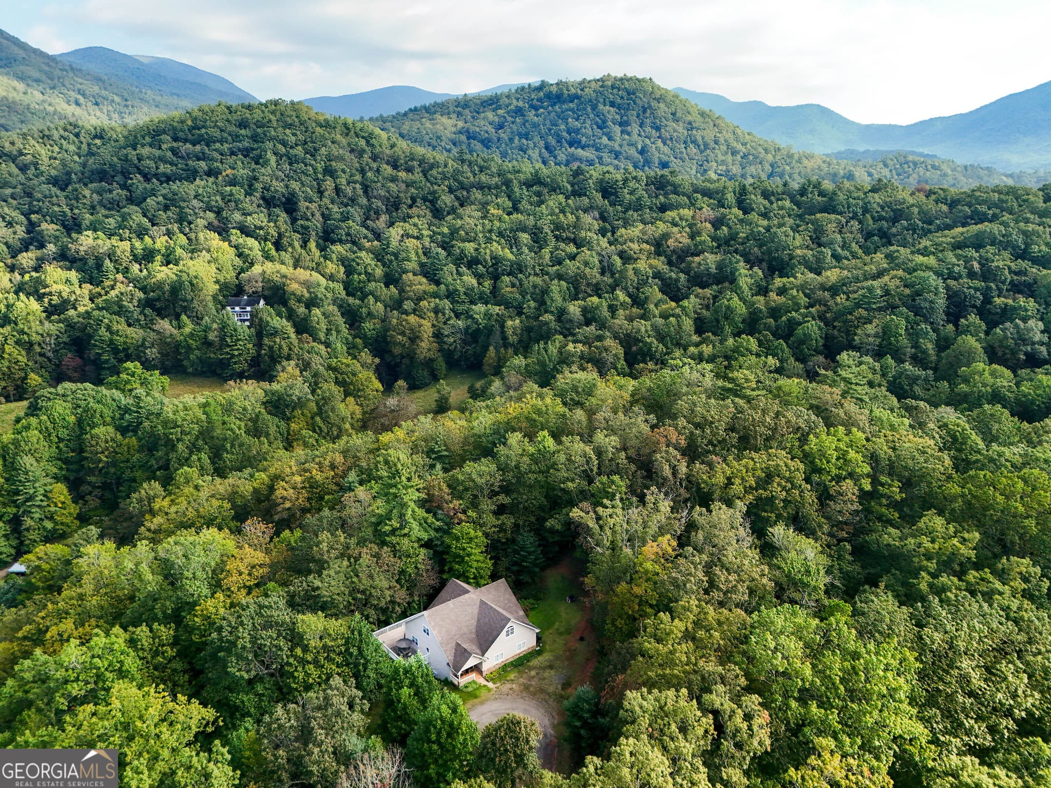 5 bedroom, 3 bathroom, 3,920 sq ft single family residence for sale at 1068 Coleman River Road, Clayton, GA 30525 — photo 1 of 71