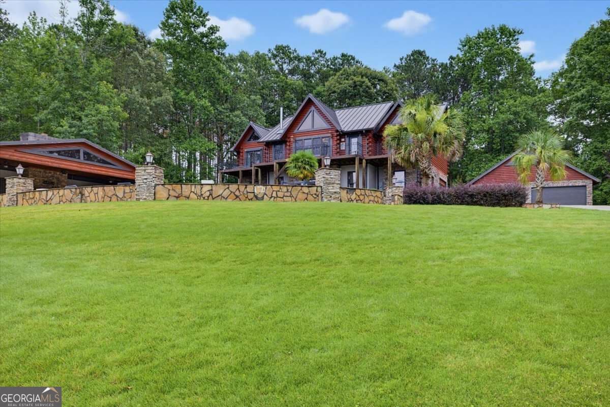 5 bedroom, 4.5 bathroom, 5,082 sq ft cabin,single family residence for sale at 4095 E Highway 166, Carrollton, GA 30116 — photo 8
