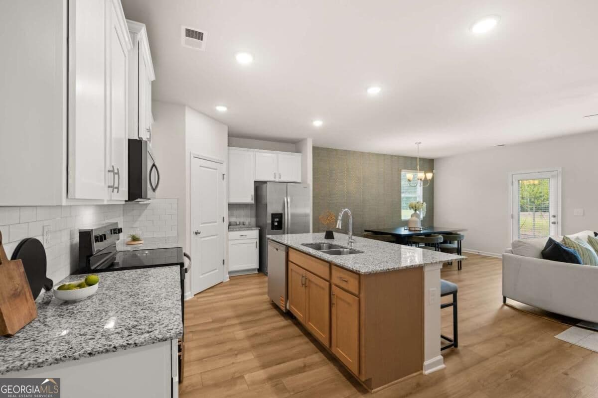 4 bedroom, 3.5 bathroom, 2,329 sq ft single family residence for sale at 1288 Harmony Ridge Court, Jonesboro, GA 30238 — photo 5