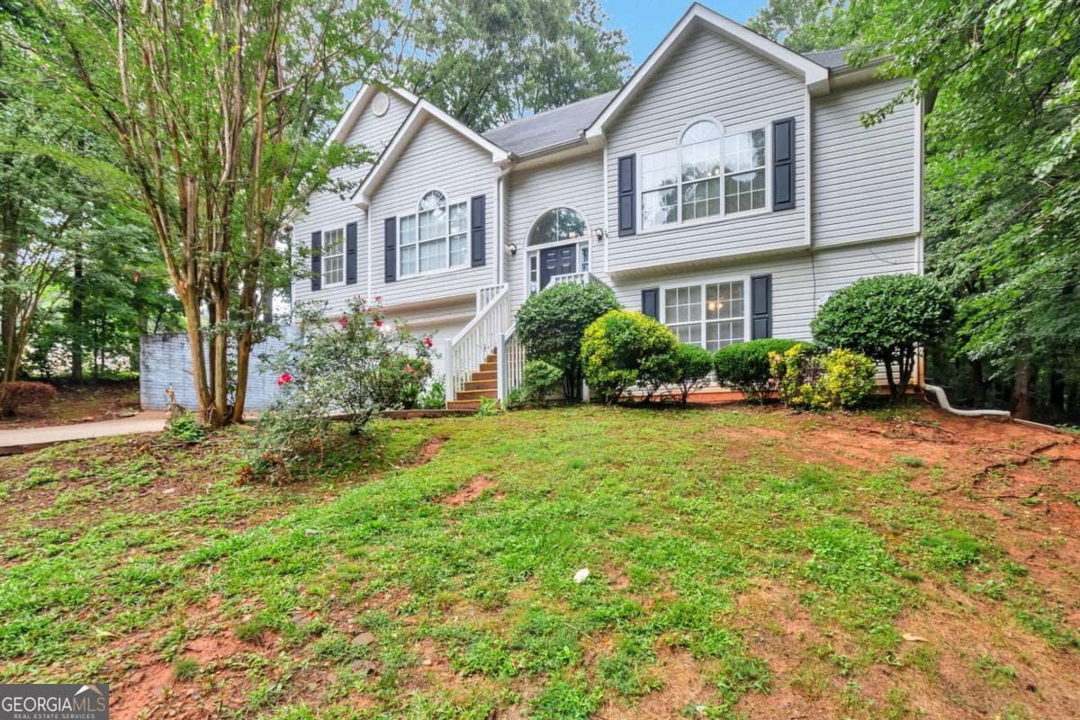 4 bedroom, 3 bathroom, 1,774 sq ft single family residence for sale at 4374 Northridge Trail, Ellenwood, GA 30294 — photo 2