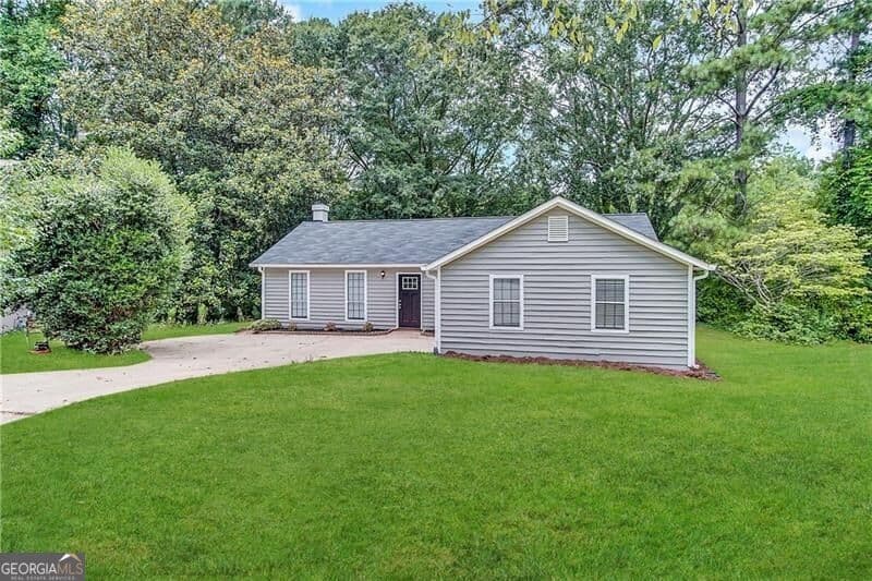3 bedroom, 2 bathroom, 1,200 sq ft single family residence for sale at 5112 Huxley Road, Stone Mountain, GA 30088 — photo 1 of 13