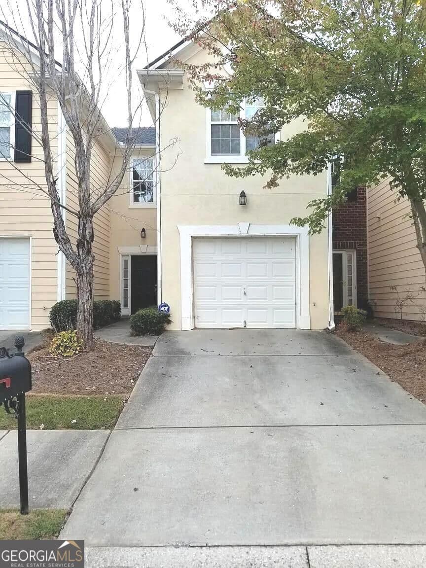 3 bedroom, 2.5 bathroom, 1,418 sq ft townhouse for sale at 7089 Biltmore Trace, Lithonia, GA 30038 — photo 1 of 12