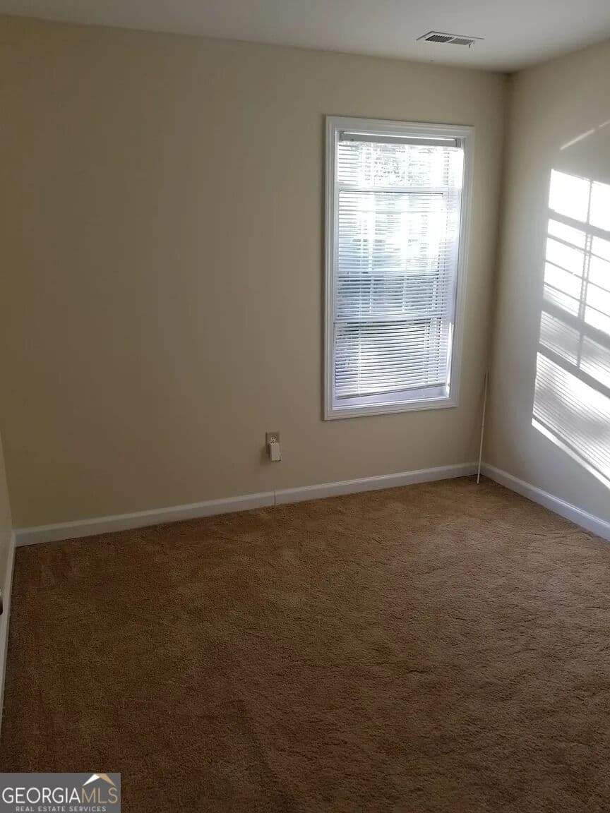 3 bedroom, 2.5 bathroom, 1,418 sq ft townhouse for sale at 7089 Biltmore Trace, Lithonia, GA 30038 — photo 5