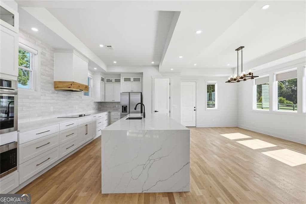 4 bedroom, 4 bathroom, 2,878 sq ft single family residence for sale at 5746 Avalon Commons Way, Clermont, GA 30527 — photo 10