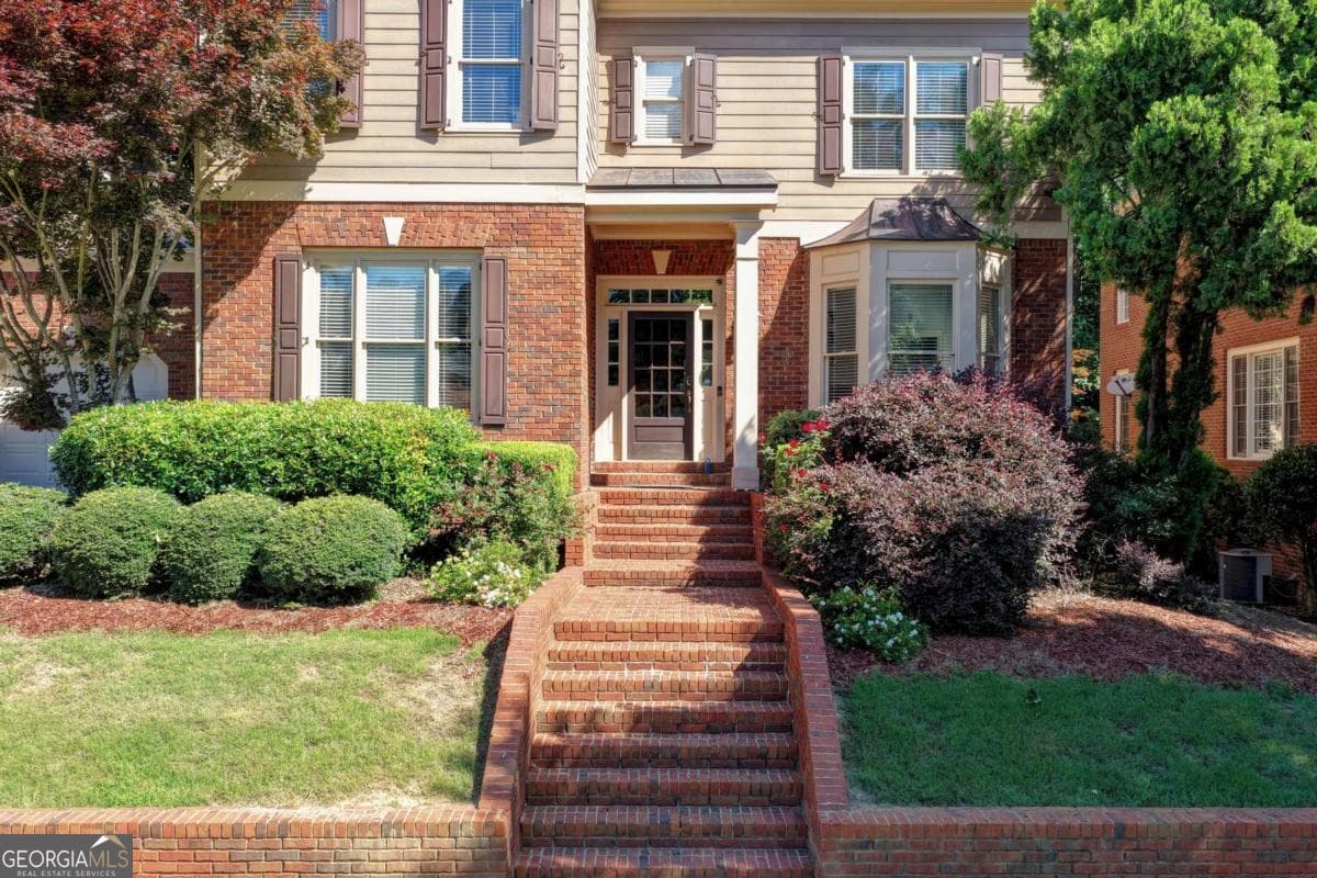 5 bedroom, 4.5 bathroom, 5,727 sq ft single family residence for sale at 991 Moores Walk Lane, Suwanee, GA 30024 — photo 2