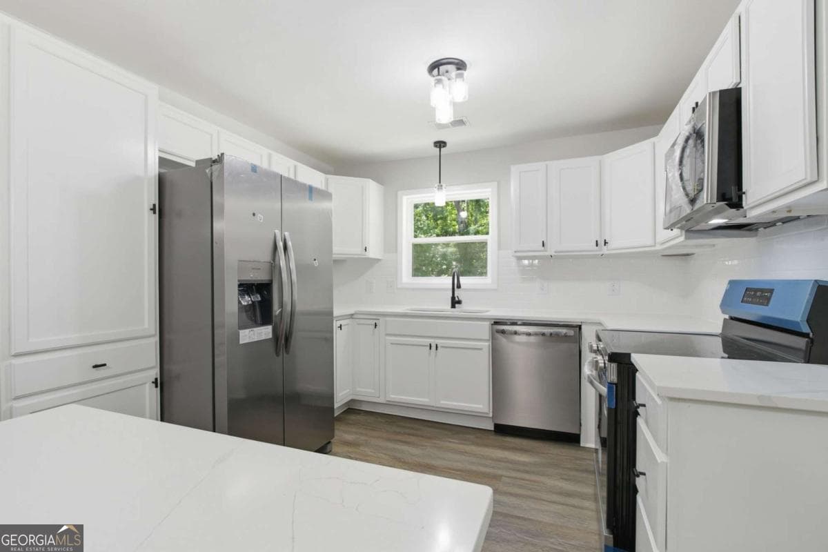 3 bedroom, 2 bathroom, 1,408 sq ft single family residence for sale at 1737 Yellow Street, Conyers, GA 30012 — photo 3