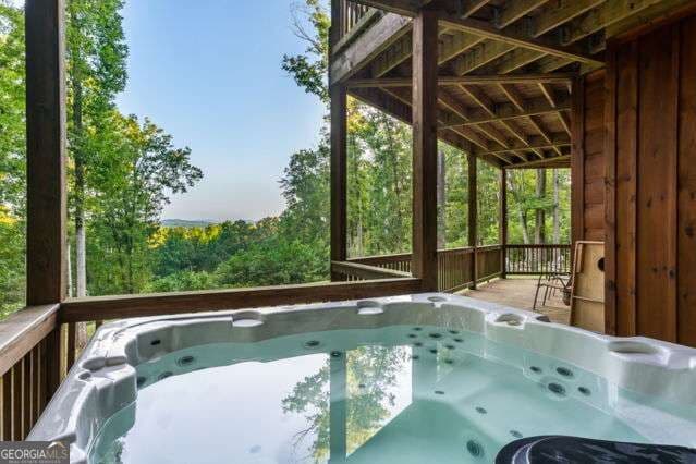 4 bedroom, 3.5 bathroom, 3,594 sq ft cabin,single family residence for sale at 34 Highland Forest Trail, Morganton, GA 30560 — photo 7