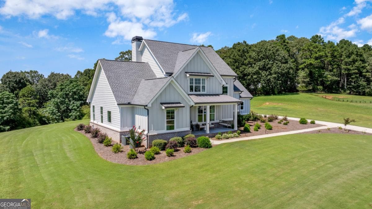 5 bedroom, 5.5 bathroom, 3,712 sq ft single family residence for sale at 815 N Hampton Way, Monroe, GA 30656 — photo 2