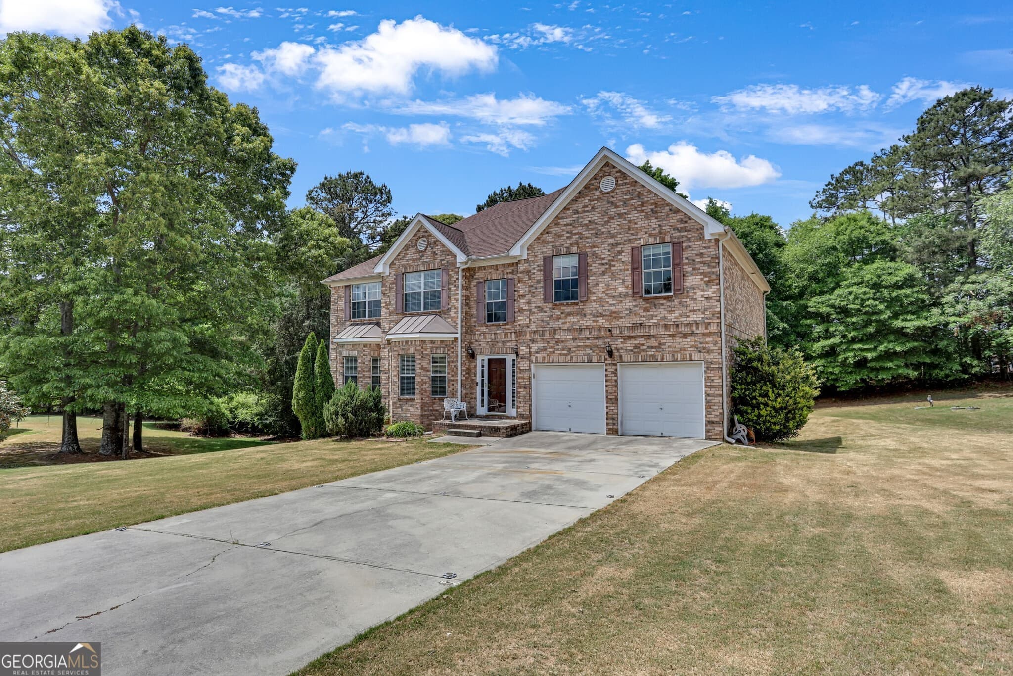 6 bedroom, 4.5 bathroom, 5,775 sq ft single family residence for sale at 605 Harris Court, Conyers, GA 30012 — photo 2