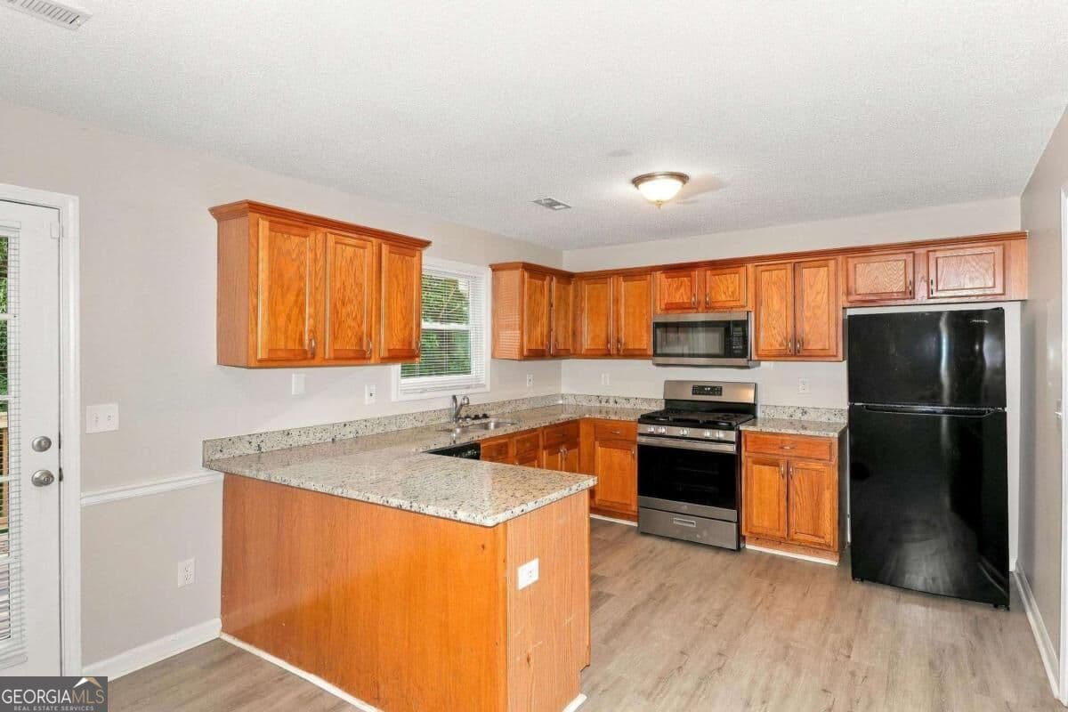 4 bedroom, 3 bathroom single family residence for rent at 5730 Broadleaf Way, Atlanta, GA 30349 for $2,120 a month — photo 2
