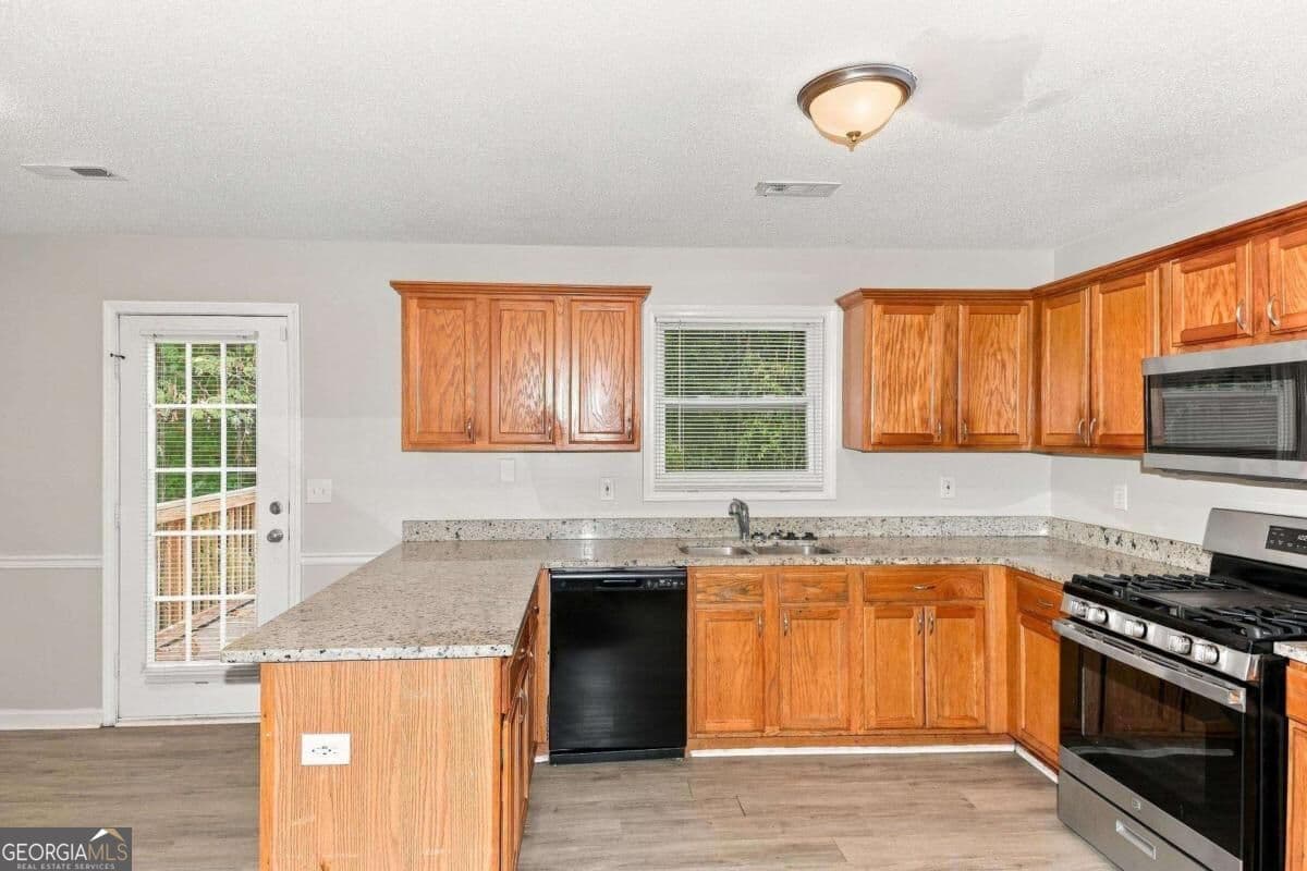 4 bedroom, 3 bathroom single family residence for rent at 5730 Broadleaf Way, Atlanta, GA 30349 for $2,120 a month — photo 3