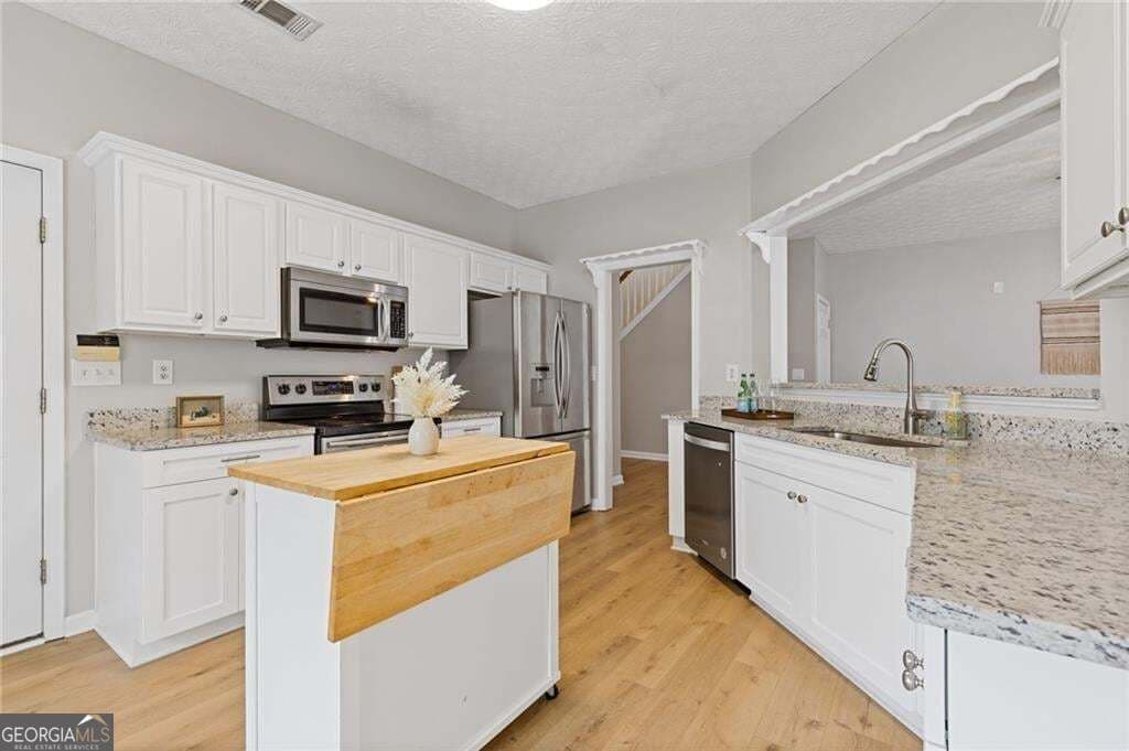4 bedroom, 3.5 bathroom, 2,758 sq ft single family residence for sale at 1755 Patrick Mill Place, Buford, GA 30518 — photo 9