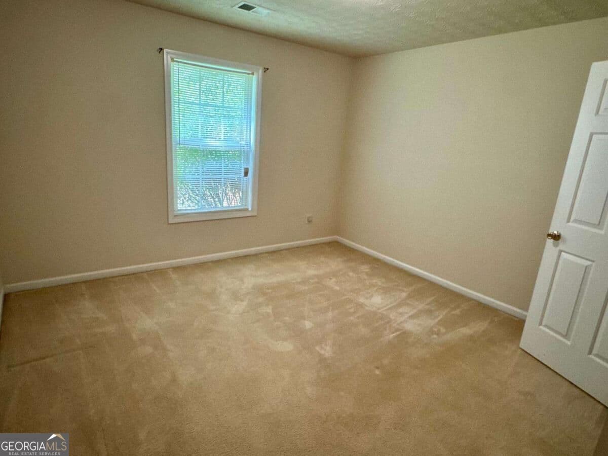 4 bedroom, 2 bathroom single family residence for sale at 1431 Log Cabin Lane, Lawrenceville, GA 30045 — photo 5