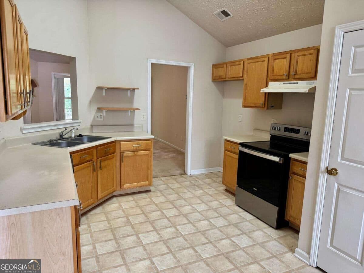4 bedroom, 2 bathroom single family residence for sale at 1431 Log Cabin Lane, Lawrenceville, GA 30045 — photo 4