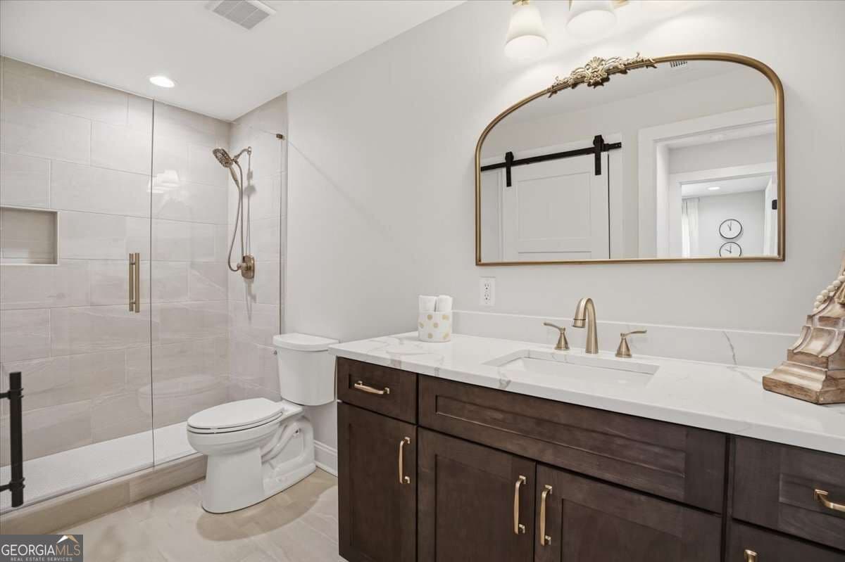 5 bedroom, 4.5 bathroom, 3,218 sq ft single family residence for sale at 6265 Privet Way, Cumming, GA 30028 — photo 5