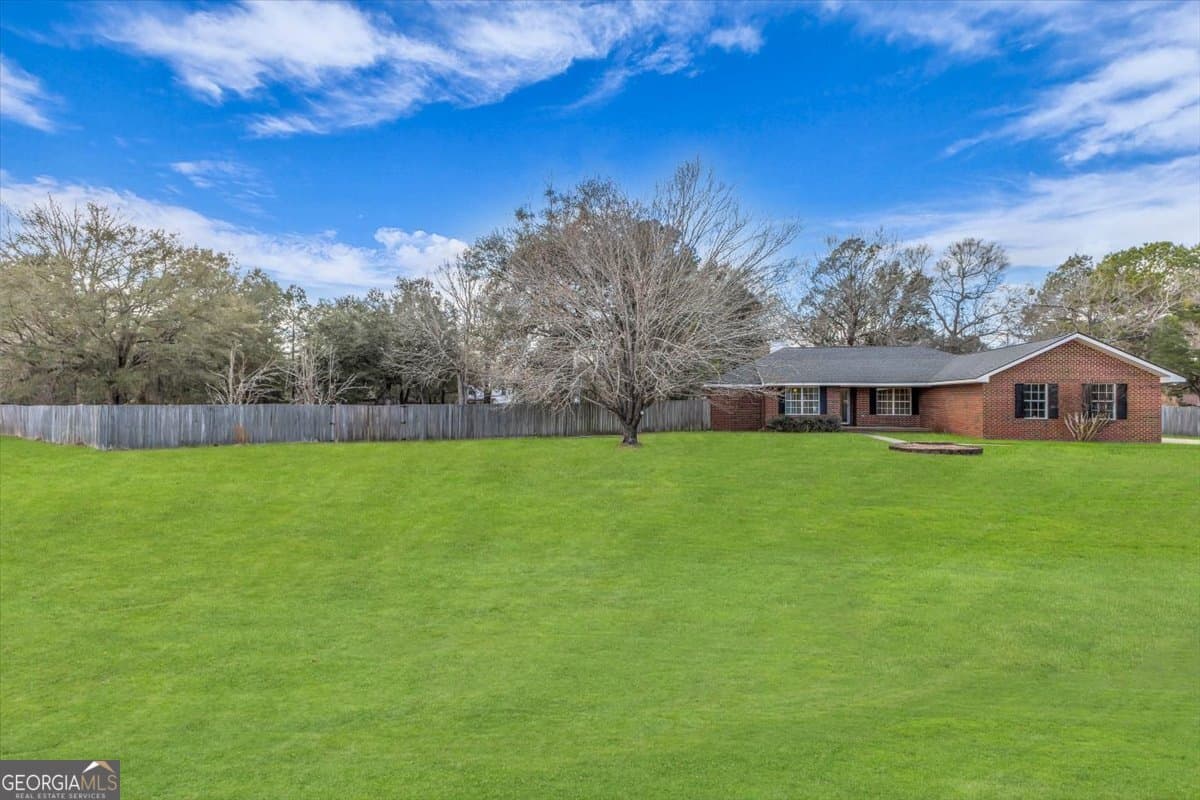 4 bedroom, 2 bathroom, 1,901 sq ft single family residence for sale at 153 Hughes Drive, Midway, GA 31320 — photo 3