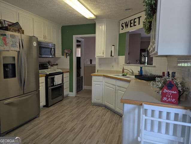 4 bedroom, 2 bathroom, 2,167 sq ft single family residence for sale at 1524 Queen Elizabeth Drive, Locust Grove, GA 30248 — photo 5