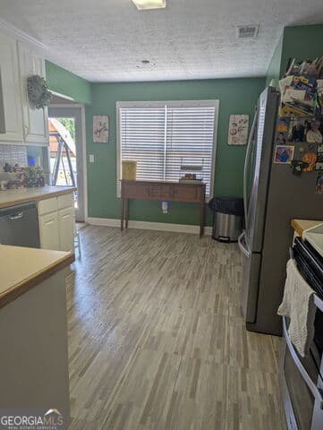 4 bedroom, 2 bathroom, 2,167 sq ft single family residence for sale at 1524 Queen Elizabeth Drive, Locust Grove, GA 30248 — photo 4