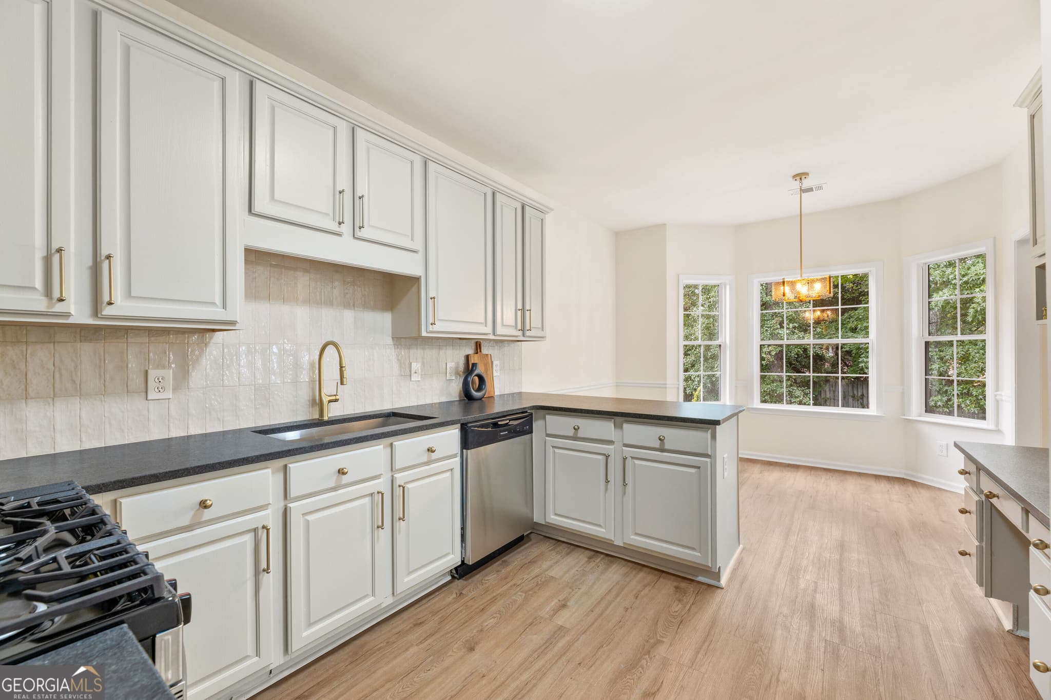 4 bedroom, 2 bathroom, 2,221 sq ft single family residence for sale at 5500 Arrowind Road, Lilburn, GA 30047 — photo 5